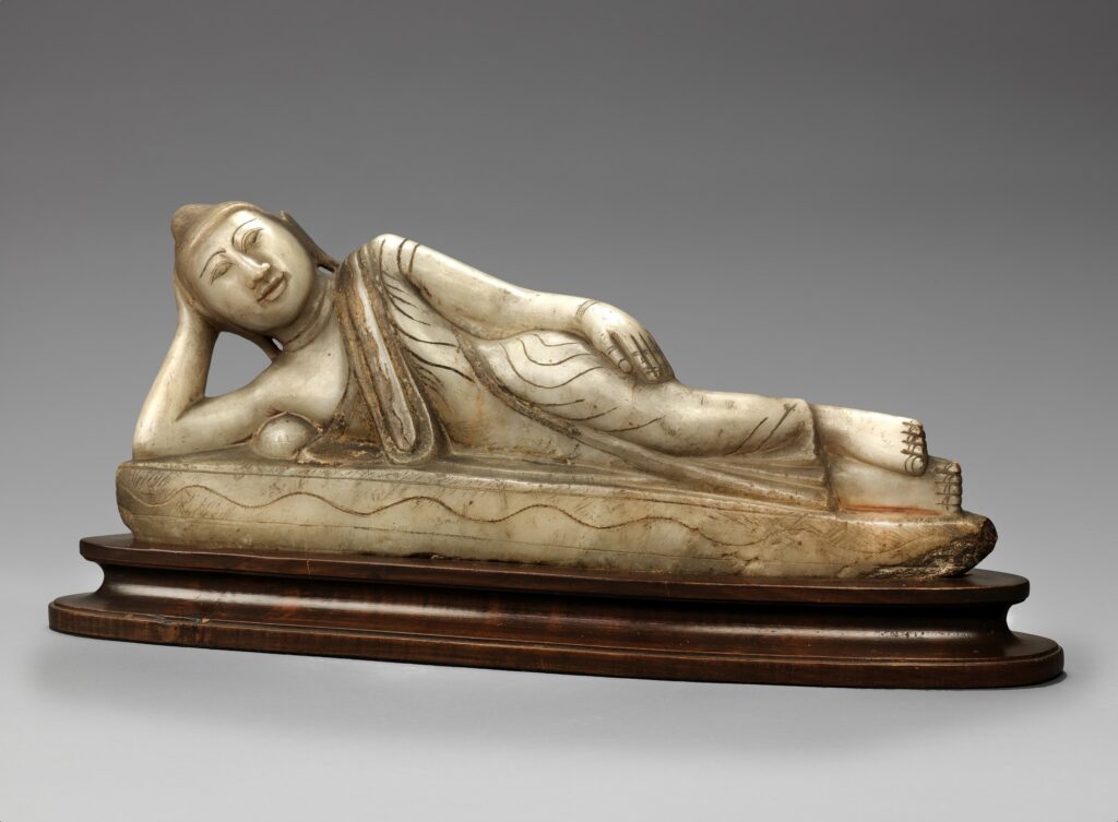 Buddha Reclining with Base,” 18th century, gilded and painted stone, Unidentified (Burmese), Smithsonian American Art Museum, Gift of William E. Huntington in memory of Alice Pike Barney, 1976.86.6A-B. Data Source: https://americanart.si.edu/artwork/buddha-reclining-base-24507ture